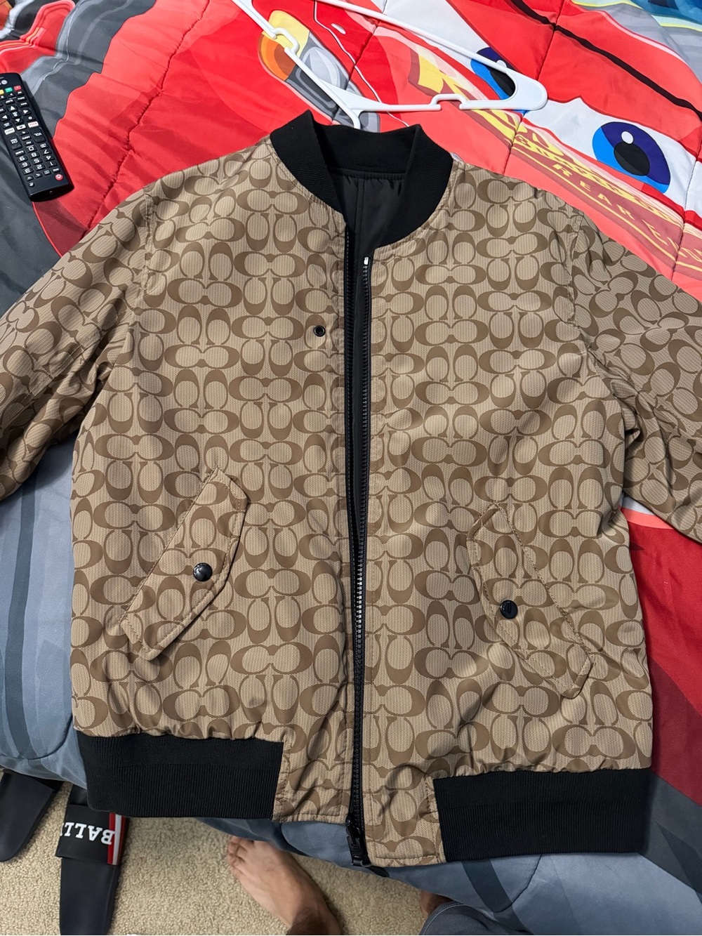 Coach logo and black reversible jacket